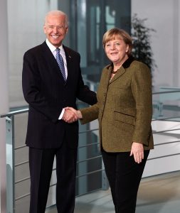 Vice President Joe Biden and German Chancellor Angela Merkel shake hands